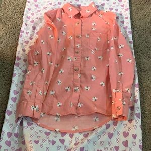 A button down long sleeve pink shirt